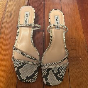 Scrappy, snake patterned heels.